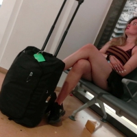 Girl sitting at the airport