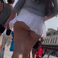 Candid brunette babe in a tiny white skirt showing her sexy ass cheeks BA145.mov-2025-08-16-08h57m13s498.jpg