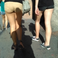 Brunette ass cheeks in short yellow shorts Brunette cheeks in short shorts