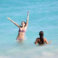 Kaia Gerber paparazzi pics in a purple bikini at the beach 06.jpg