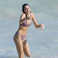 Kaia Gerber paparazzi pics in a purple bikini at the beach 07.jpg