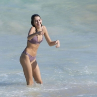 Kaia Gerber paparazzi pics in a purple bikini at the beach 08.jpg