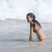 Kaia Gerber paparazzi pics in a purple bikini at the beach 04.jpg
