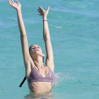 Kaia Gerber paparazzi pics in a purple bikini at the beach 12.jpg