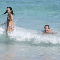 Kaia Gerber paparazzi pics in a purple bikini at the beach 11.jpg