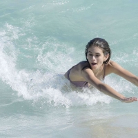 Kaia Gerber paparazzi pics in a purple bikini at the beach 15.jpg