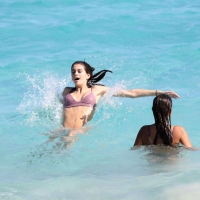 Kaia Gerber paparazzi pics in a purple bikini at the beach 24.jpg