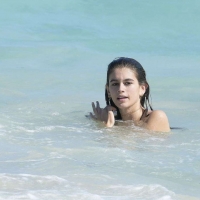 Kaia Gerber paparazzi pics in a purple bikini at the beach 26.jpg