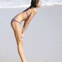 Kaia Gerber paparazzi pics in a purple bikini at the beach 25.jpg
