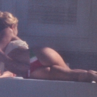 Shakira out on a boat in a thong bikini showing her great booty 03.jpg