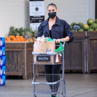 Lori Harvey grocery shopping at Bristol Farms in West Hollywood in leggings 01.jpg