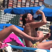 Multiple candid topless babes at the beach showing their boobs boobs-and-sunbeds-32-108.jpg