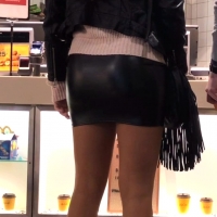 Brunette in tight leather skirt
