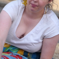 Plump candid milf showing her lace bra and cleavage while eating food1.jpg