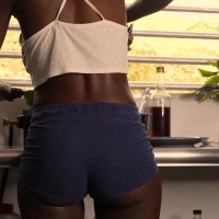 Sexy black girl making pancakes