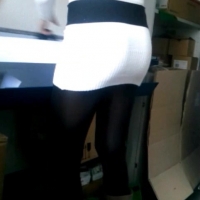 Coworker Marie in white skirt