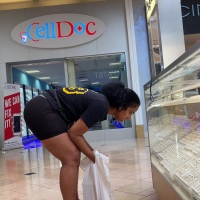 Sexy candid black girl with a big booty in tight black spandex shorts at the mall vid_327.mp4-2022-09-02-09h57m46s439.jpg