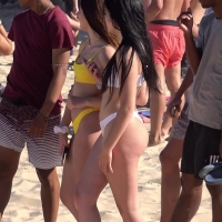 Two babes in thong bikinis