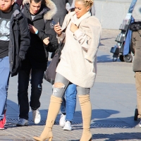 candidstreet_32037335018_Blonde beauty in ripped jeans & boots overknees.jpg