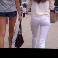 Skinny teen in shorts and friend in jeans