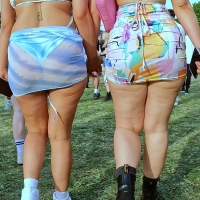 Sexy candid lesbian couple in little skirts at a festival with one showing her thong vlcsnap-2022-06-22-19h14m10s772.jpg