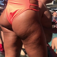 Sweet ass in peach swimsuit