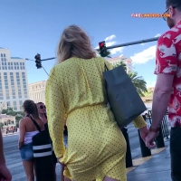 Babe trying to contain her skirt