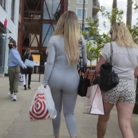 Blonde in grey onesie
