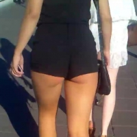 Cheeky in black shorts