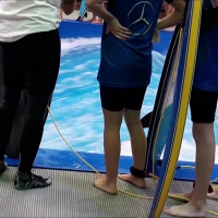 Surf instructor in swim leggings