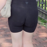 Nerdy girl in biker shorts