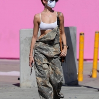 Madison Beer out in overalls and tiny white crop top showing her sexy cleavage Madison-Beer---In-camouflage-overalls-lunch-outing-in-West-Hollywood-03.jpg