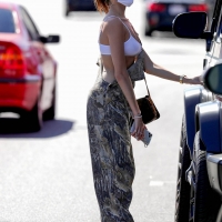 Madison Beer out in overalls and tiny white crop top showing her sexy cleavage Madison-Beer---In-camouflage-overalls-lunch-outing-in-West-Hollywood-01.jpg
