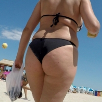 Sexy candid blonde beach lady with a dimpled ass in a black bikini GOPR0081.MP4-2022-10-26-06h29m08s261.jpg
