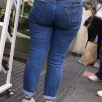 Shapely booty on store worker in tight jeans Shapely booty