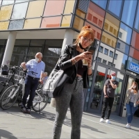 Nerdy redhead in jeans