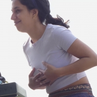 Latina girl grabs her tits
