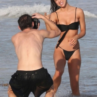 Alexis Ren in black bikini on the beach in Tulum Alexis Ren sexy on the beach