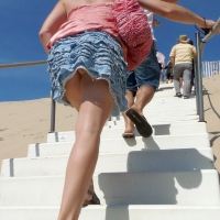 Girl upskirted while walking up stairs at the beach Upskirt up the stairs