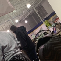 Candid big booty ebony milf shopping in black and white patterned leggings 65695634.jpg