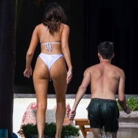 Olivia Culpo showing off her sexy body in a white bikini poolside in Cabo San Lucas 01.jpg