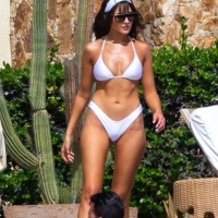 Olivia Culpo showing off her sexy body in a white bikini poolside in Cabo San Lucas 02.jpg