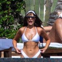 Olivia Culpo showing off her sexy body in a white bikini poolside in Cabo San Lucas 27.jpg