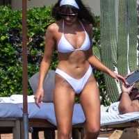 Olivia Culpo showing off her sexy body in a white bikini poolside in Cabo San Lucas 29.jpg