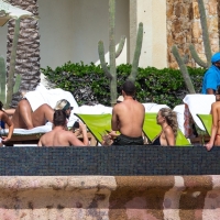 Olivia Culpo showing off her sexy body in a white bikini poolside in Cabo San Lucas 25.jpg