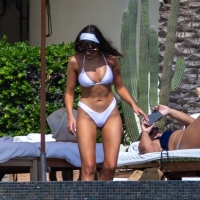 Olivia Culpo showing off her sexy body in a white bikini poolside in Cabo San Lucas 44.jpg
