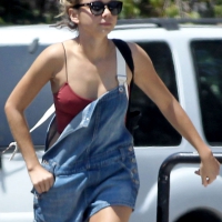 Sarah Hyland shopping in L.A. with crop top showing pokies and short overalls Sarah Hyland pokies and short overalls