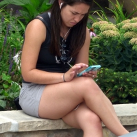 Thick brunette listening to music in shorts Thick brunette in shorts