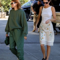 Hailey Bieber with Kendall Jenner showing her braless boobs and pokies in a white top at the Beverly Grill in Beverly Hills 20.jpg