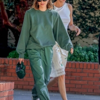 Hailey Bieber with Kendall Jenner showing her braless boobs and pokies in a white top at the Beverly Grill in Beverly Hills 19.jpg
